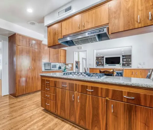 Warm-Wood-Kitchen-with-Seed-Glass-Doors.